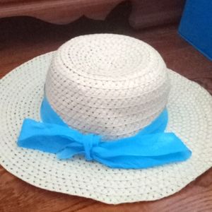 Lady's straw hat with blue bow